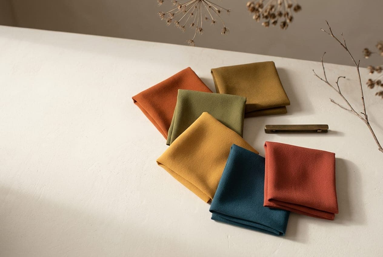 Folded squares of fabric in the Autumn palette