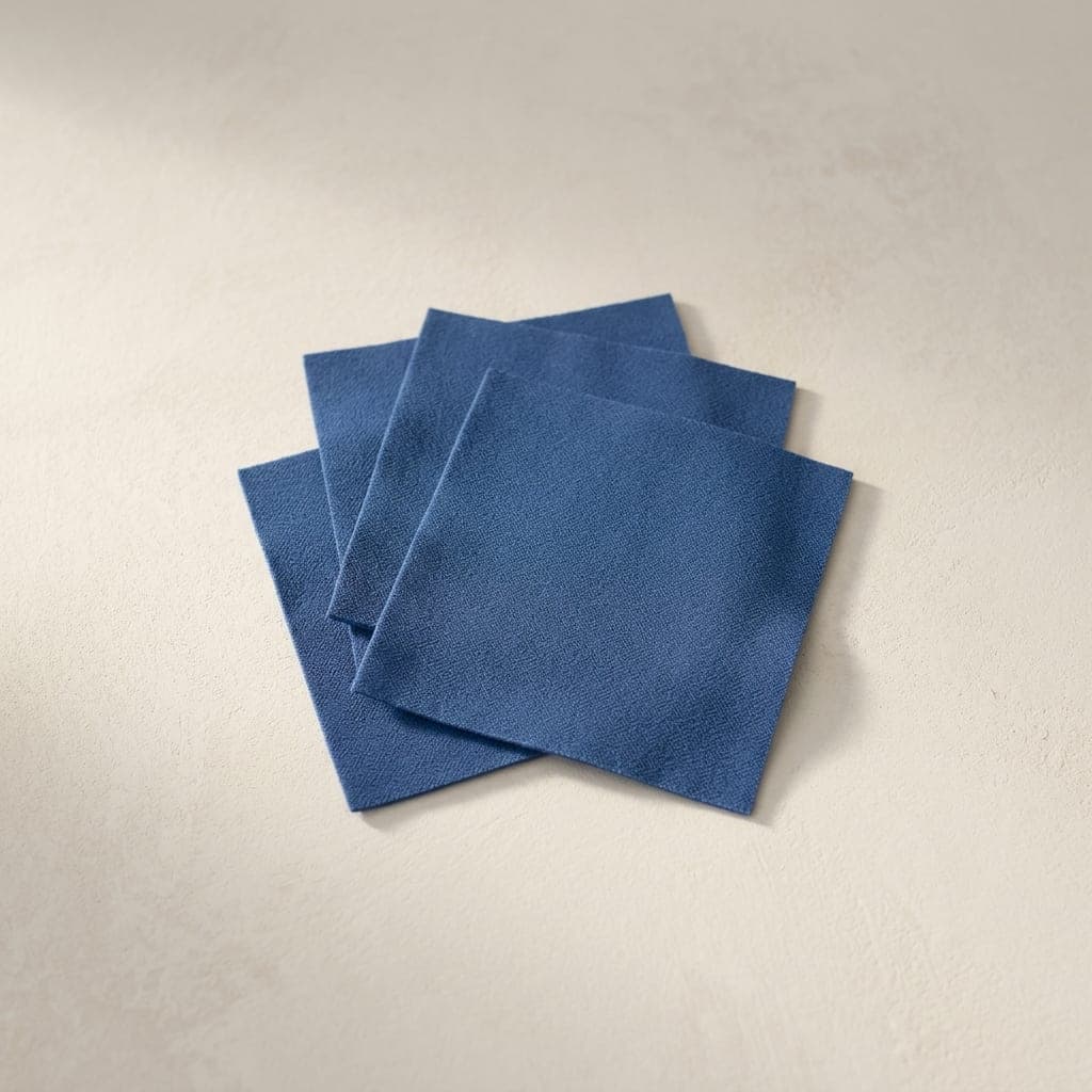 Folded squares of matte crepe in mid cornflower blue
