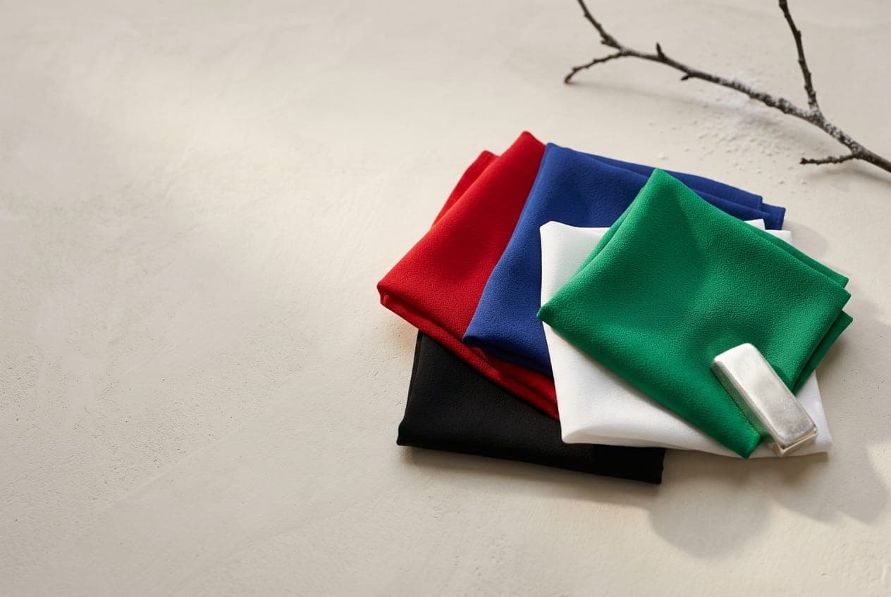 Folded squares of fabric in the Winter palette